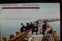 Vacationers on breakwater at Great Lakes Naval Facility